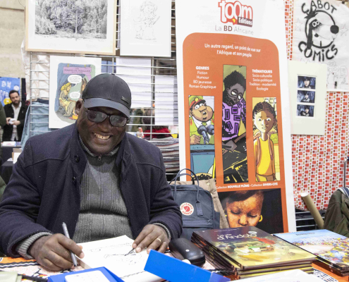 Stand des éditions Toom et son directeur Simon Mbumbo Stand des éditions Toom